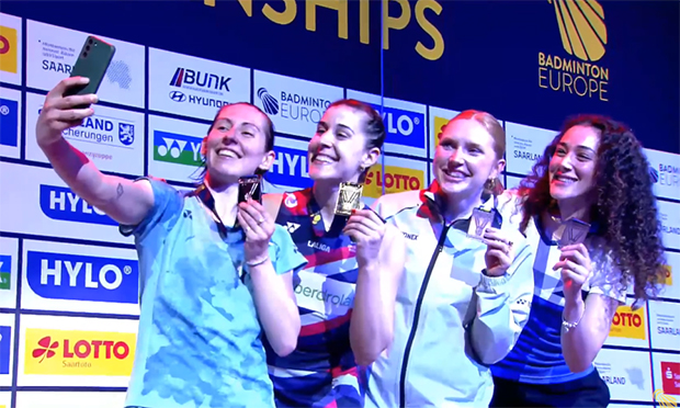 After securing her unprecedented 7th consecutive European Championships title, Carolina Marin poses for photos with the other women